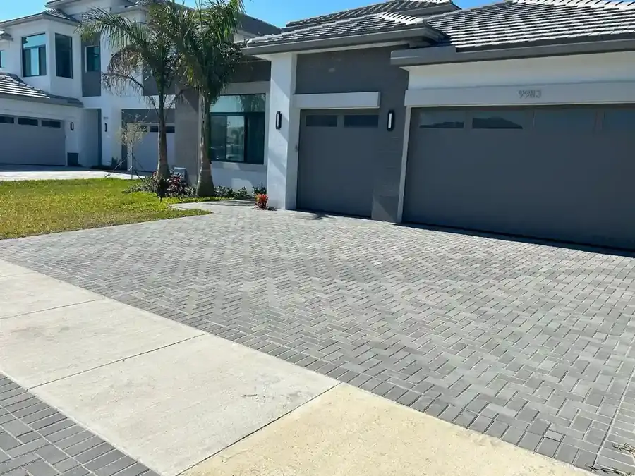Gray paver driveway installation